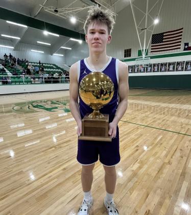 GOLDBALLSEASON Junior Matteo Schwetting shows off Benjamin bi-district gold ball afterTuesday night's win. | SUE JANE SULLIVAN PHOTO