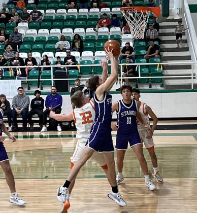 MUSTANG VICTORY #3 Senior Weston Weatherford goes for the layup in Benjamin's 102-54 bidistrict win over the Rotan Yellowhammers Tuesday night in Hamlin. | SUE JANE SULLIVAN PHOTO
