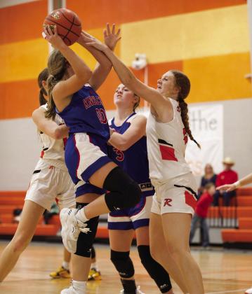 Jaden Baxter takes the foul as she goes up for the layup. | SHERI BATY PHOTO