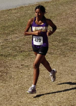 MUNDAY GIRLS ONTHE RUN Among the Regional Cross Country runners representing Munday was Michelle Lopez and Maeley Evans. | LACI BOWMAN PHOTOS