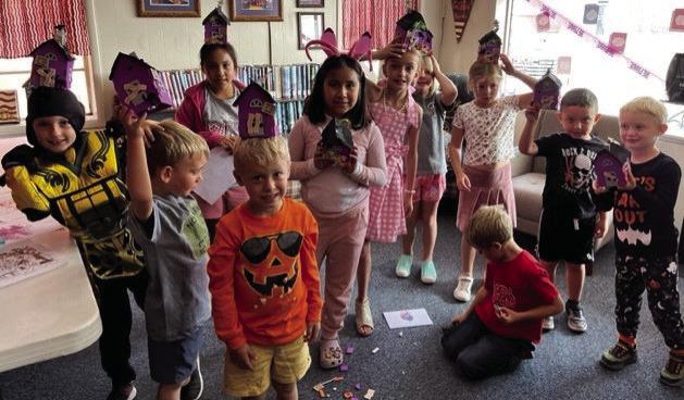 HALLOWEEN ATTHE LIBRARY Library participants showing off their costumes and crafts on Oct. 21 | PHOTO BY AMANDA BURBANK