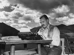 Ernest Hemingway at his typewriter.