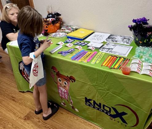 SO MUCH TO CHOOSE FROM The Knox County 911 team displayed an offering of coloring pages, pencils, stickers and much more for visitors to choose from to take home as souvenirs from their visit to the Health Fair. | RACHEL FARMER PHOTO