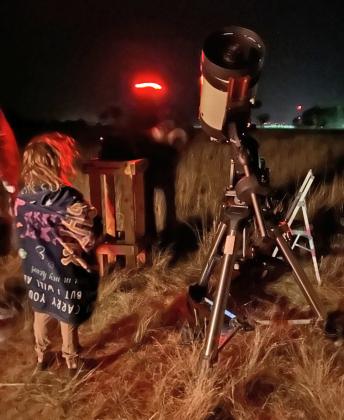 STARGAZING Gazing at the stars through the telescope with Alex Vakusin. |COURTESY PHOTO