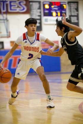 DRIVES Joe Adam Morelos takes the pressure from the Crowell Wildcar as he drives down the court. | SHERI BATY PHOTOS