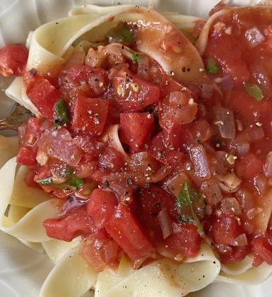 FRESH TOMATO SAUCE WITH PAPPARDELLE has savory tender, wide noodles with a homemade fresh tomato sauce bursting with the flavor of ripe tomatoes, aromatic garlic, and fresh basil—an irresistible combination that elevates your meal to a comforting, gourmet experience.The bright acidity and natural sweetness of the tomatoes create perfect harmony with the al dente pasta, offering a wholesome, satisfying dish that nourishes both body and soul. | ANGELINA LARUE PHOTO