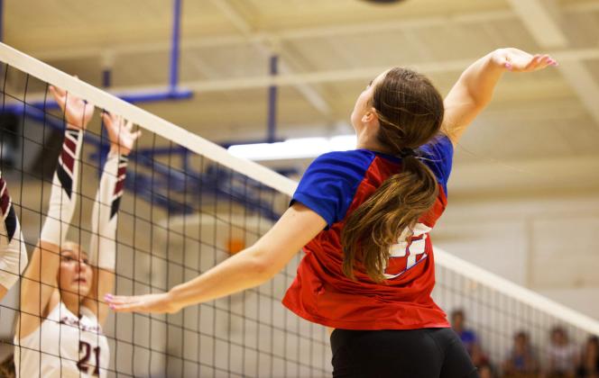 GOING FORTHE KILL Grayson Utley goes for the kill shot against Lingleville. The Houndettes won the game with each set ending in a score of 1-0. | SHERI BATY PHOTO