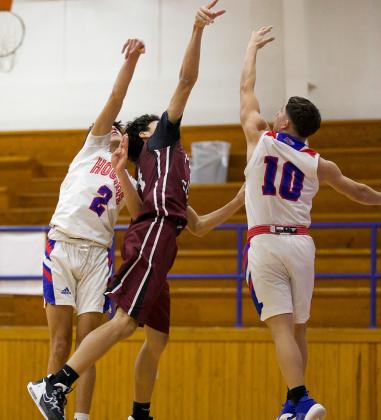 Caleb Arrieta and Joe Adam Morelos double team the Paint Creek Pirate at the net. | SHERI BATY PHOTO