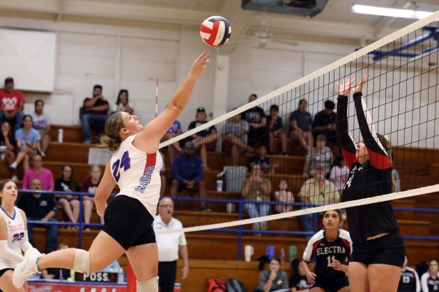 Kateleigh Carr attacks the ball at the net.