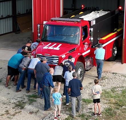 BENJAMINVFD members past and present helped get their new apparatus in the station, the push-in tradition dates back to an era when firefighting equipment was pulled by horses. | TROY PARTON