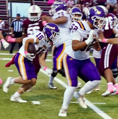 MAKING A HOLE Amyas Ibarra opens the hole for Bryson Nunez Friday, Oct. 2. The Moguls came up short, 49–26, in Seymour.