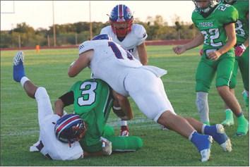Blake Abila and Tristin Baxter make the defensive stop. | SHERI BATY PHOTO