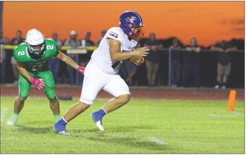 Tristin Baxter heads off into the sunset of the endzone for 6. | SHERI BATY PHOTO