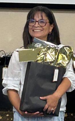 ELEMENTARY TEACHER OF THEYEAR Josy Barnum of Knox City Elementary received a gift bag and accolades in front of her family and colleagues from across the region.