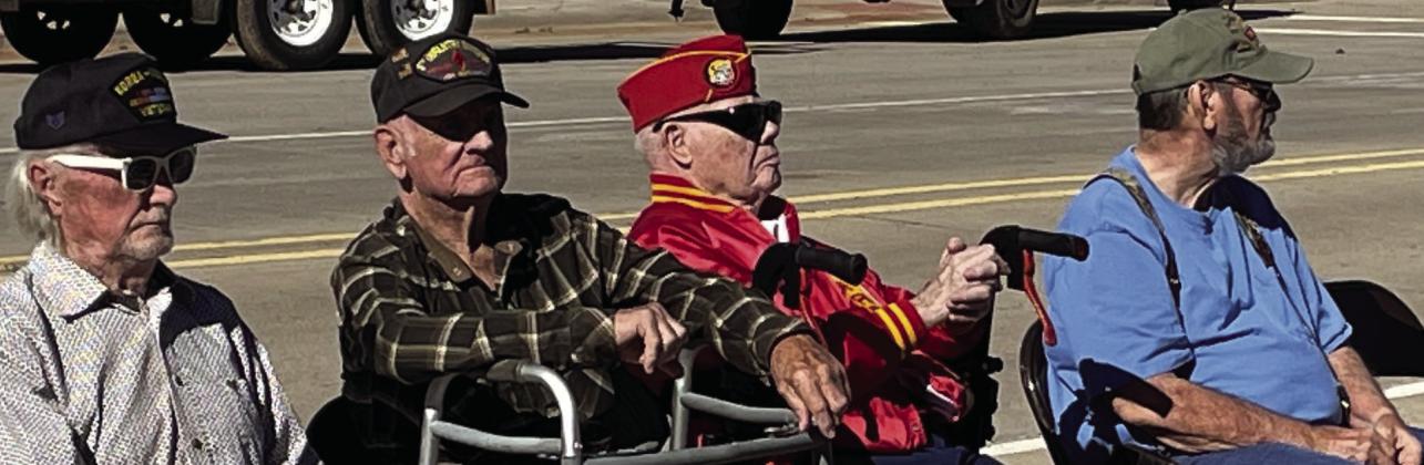 OLDESTVETERANS Front row seats reserved for older veterans, L to R, Walter Kirkpatrick, Glen Dell Large, Robert (Bob) Lake, and Frank Dutton. | DON THOMPSON PHOTO