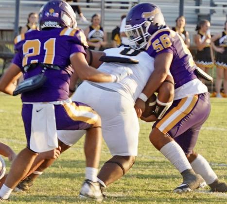 CASTORENAMAKESTHESTOP Chico’s running back is stopped by Jakob Castorena where Munday goes on to win the game 26-18. | LACI BOWMAN PHOTO