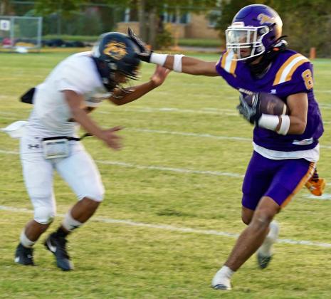 GOING FOR EXTRA YARDS Josh Dockins made a big catch and carried the ball for extra yards in Friday night’s win against the Dragons. | LACI BOWMAN PHOTO