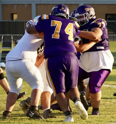 MOGUL DEFENSE AT WORK Abraham Gonzalez and Keelin Rogers work on the Mogul defensive line as the Moguls pull off the victory against the Chico Dragons in Friday night’s matchup. | LACI BOWMAN PHOTO