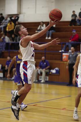 Gage Morrow drives the lane for the lay up Sheri Baty/The Knox County News-Courier