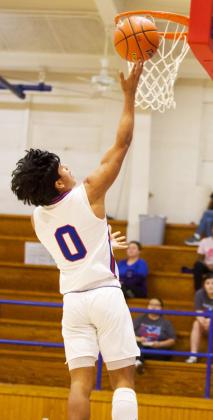 LAYING IT IN Zander Abila lays it in against the Rotan Yellowhammers in Friday’s win with a final score Greyhounds 73, Yellowhammers 20. | SHERI BATY PHOTO