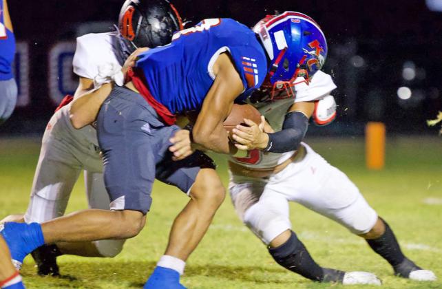 THE PUSH IS ON AGAINST STRAWN Zander Abila tries to push closer to the goal line. | SHERI BATY PHOTO