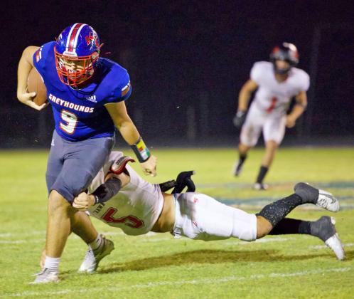 ESCAPINGSTRAWNDEFENDER Chase Rowland escapes the Strawn defender and gains some yards. | SHERI BATY PHOTO