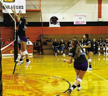 STANG SUCCESS On defense backing up the blockers at the net are #4 junior Eryn Cottingham and #15 senior Celestte Doran. | SUE JANE SULLIVAN PHOTO