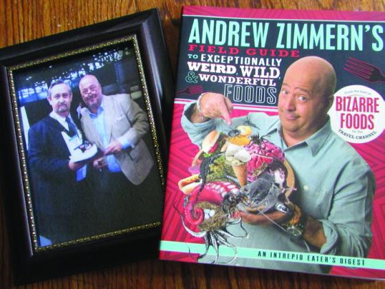 HOST OF BIZARRE FOODS Andrew Zimmern autographed his book for me with the catch phrasefromhistelevisionshow…“Ifitlooksgood, eat it!”, and we talked about eating “real Chinese food”in China. | DONTHOMPSON PHOTO