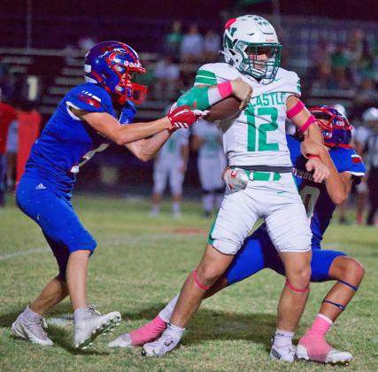 TEAMEFFORT Bently Stroud and Hunter Lerma work together for the tackle in Friday night’s game against Newcastle. The final score found the Greyhounds shutdown and shutout 0-52 respectively. | SHERI BATY PHOTO