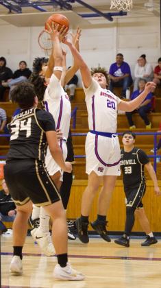 UPFORTHEREBOUND Greyhound Camden Swanson goes up for the rebound against the Crowell Wildcats on Friday, Jan. 30. The Wildcats were able to generate momentum, but the Greyhounds pulled away late to win the game. | SHERI BATY PHOTO