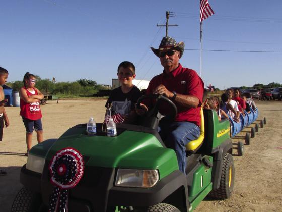 MARK REED DROVE the kiddie train all around the grounds. | DONTHOMPSON PHOTO