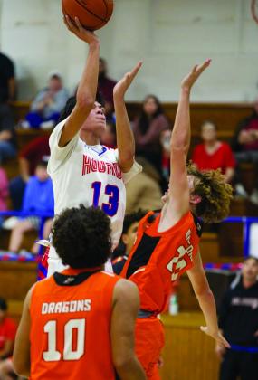 AND ONE Blake Abila drives to the hoop for two and the foul for plus one. | SHERI BATY PHOTO