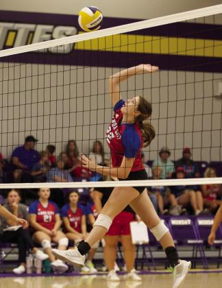 Grayson Utley attacks the ball at the net. | SHERI BATY PHOTO