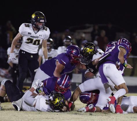 GOAL LINE Tristin Baxter goes face to face with the Happy ball carrier. | SHERI BATY PHOTO