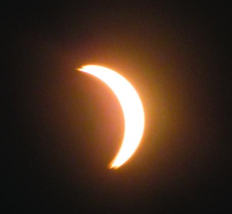 SOLAR ECLIPSE The view from KnoxCountyasthesolareclipse begins, peaks and diminishes. | RICHARD THOMPSON, MARGARET FRIEND PHOTOS
