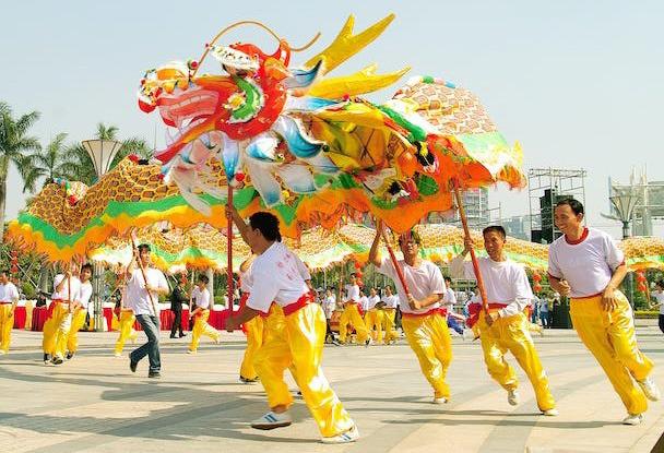 DANCING CELEBRATION The dragon weaving down the street | COURTESY PHOTO