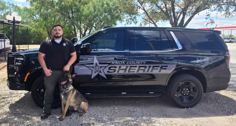 NEWRIDE Deputy Garza and K9 Deputy Max pose in front of their new wheels.The specially equipped Tahoe features a kennel, cooling fans and a heat sensitive locking system, to keep Max cool and ready for duty. | COURTESY PHOTO