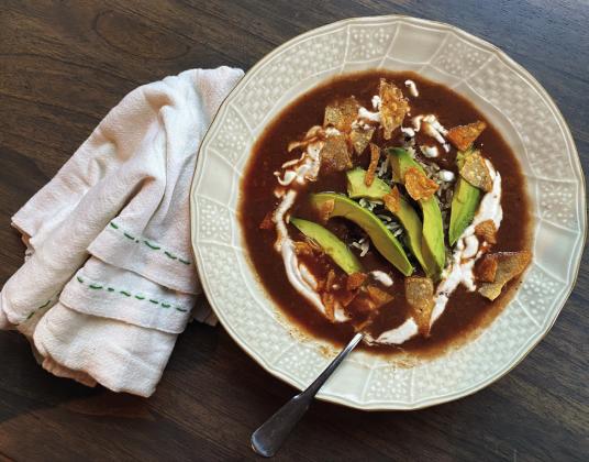 MEXICAN SOUP Sopa Tarasca a traditional Mexican soup that is rich and hearty dish features a delicious blend of flavors, combining ingredients of tomatoes, garlic, onion, and various spices.The soup is enriched with chicken and garnished with avocado, cheese, and sour cream, providing a delightful contrast of textures and tastes. | ANGELINA LARUE PHOTO