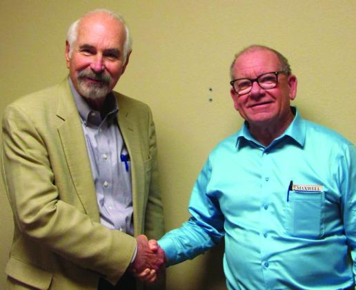 Judge Stan Wojcik swears in Dr. Michael Bennington. Don Thompson/The Knox County News-Courier