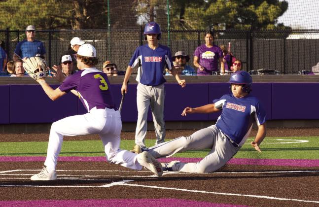 SHOWDOWN Chase Rowland slides for homeplate. see more photos page 6. | SHERI BATY PHOTO