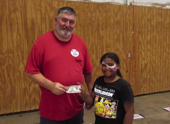 THEWINNEROFTHE 12&amp;amp;underHotDogEatingContesttookhome the $100 prize. | DONTHOMPSON PHOTO