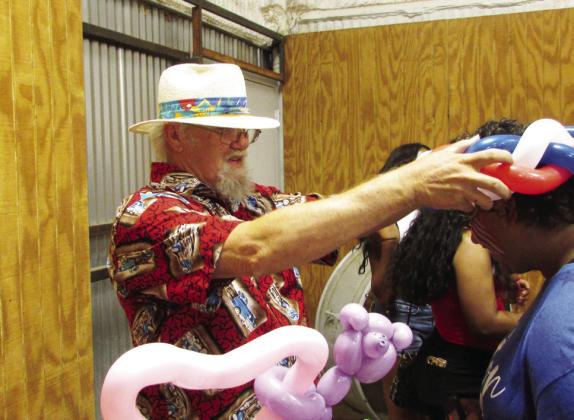 KIDS ENJOYED the balloon animals. See more photos page 2 and page 5. | DON THOMPSON PHOTO