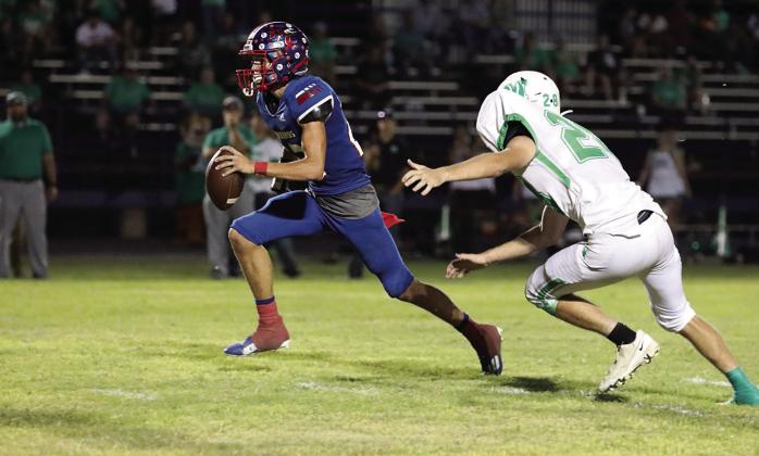 Bryson Callaway runs for the first down Sheri Baty/The Knox County News-Courier