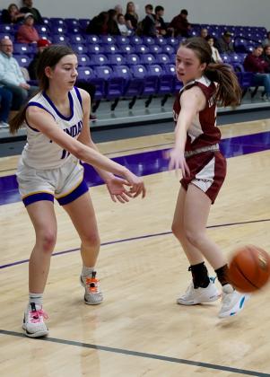 Kamryn Rocha dishes the ball under the basket. | LACI BOWMAN PHOTO