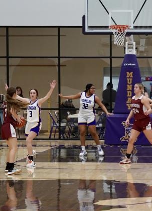 Serenity Sanchez blocks out the defender on a free throw. | LACI Mogulettes make a defensive stop. | LACI BOWMAN PHOTO BOWMAN PHOTO