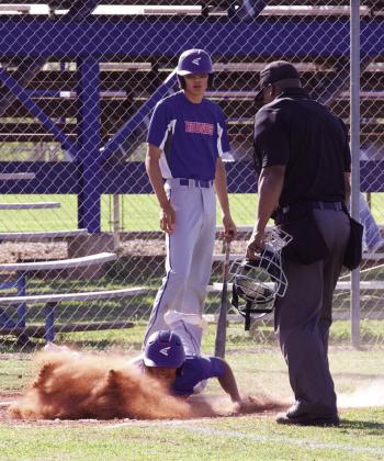 Zander Abila slides home. | SHERI BATY PHOTO