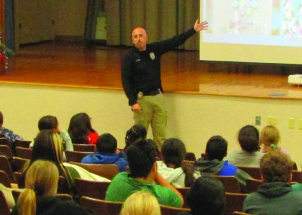 Officer Brian Arias, Crime Stoppers Coordinator with the Wichita Falls Police Department, addresses students about drug awareness.