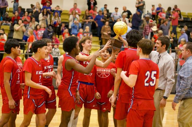 The Greyhounds and their BIDISTRICT trophy. | SHERI BATY PHOTO