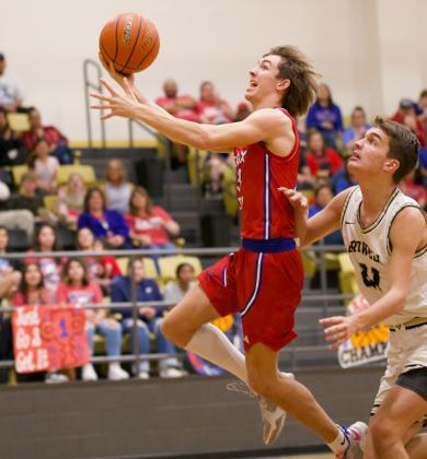 Bryson Callaway makes the layup for the Greyhounds. | SHERI BATY PHOTO