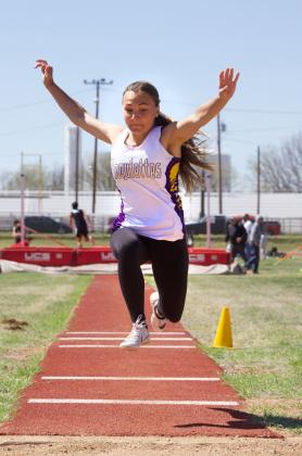 MUNDAY MOGULETTE airborne in the long jump.